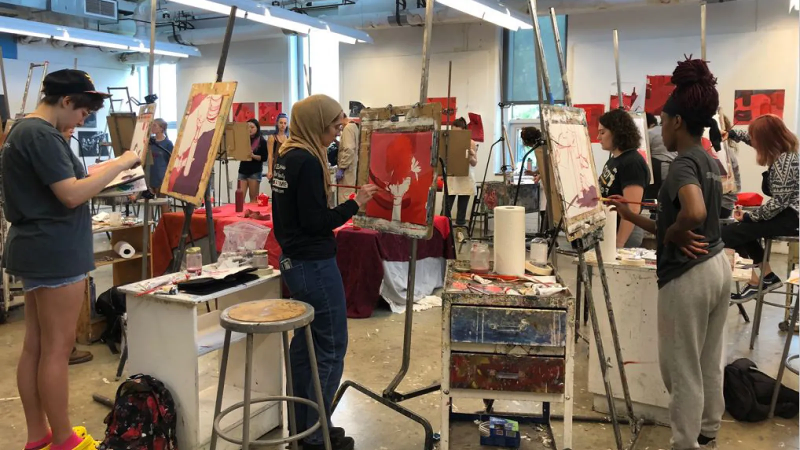 students painting in class