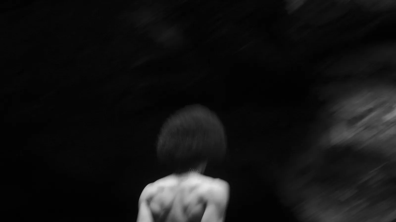 photo of a person moving away from the camera