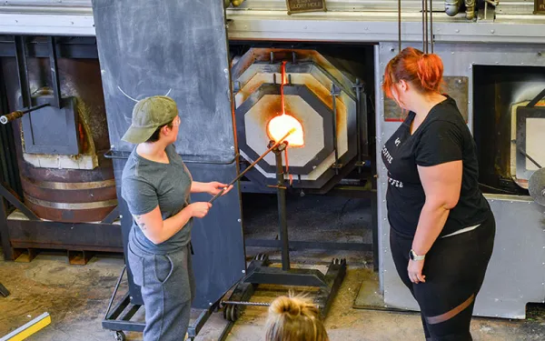 Students working in glass studio