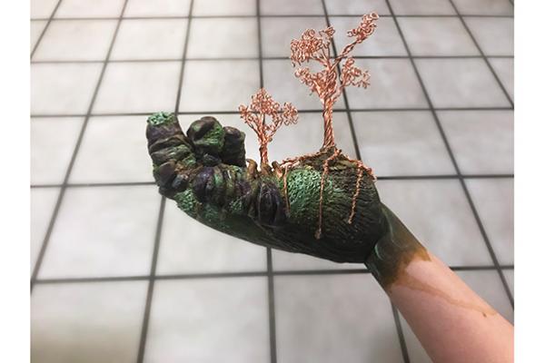 Image of hand incorporated in sculpture