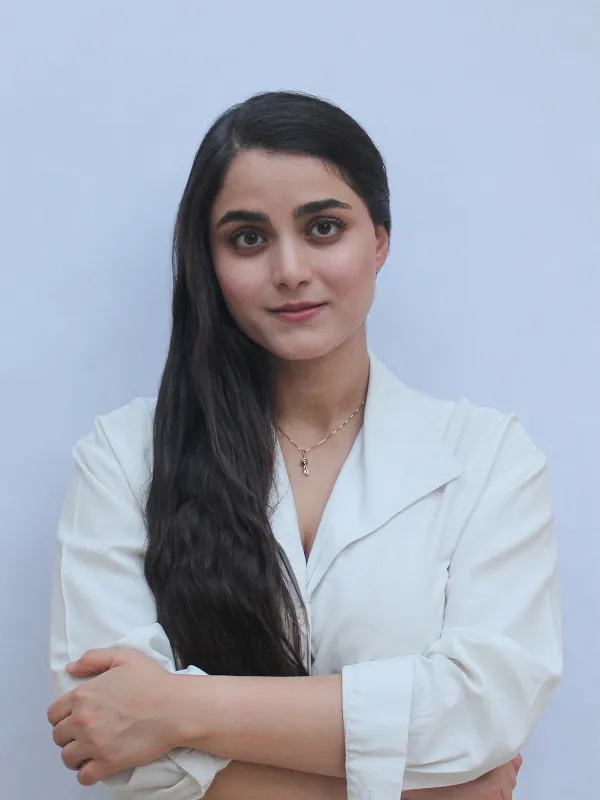 a person standing with crossed arms