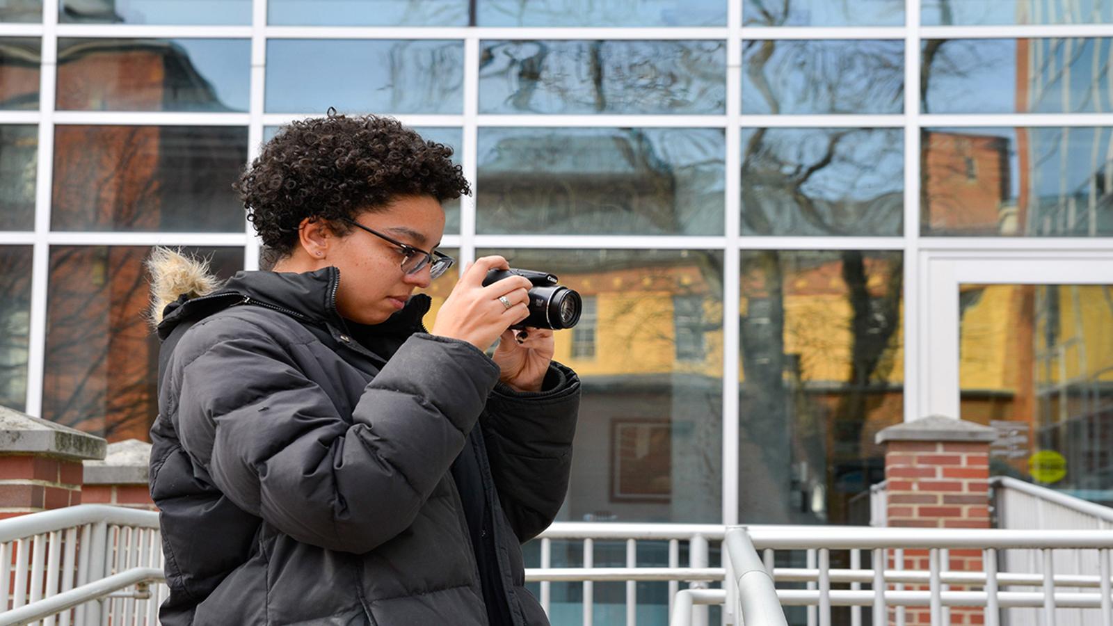 student with camera