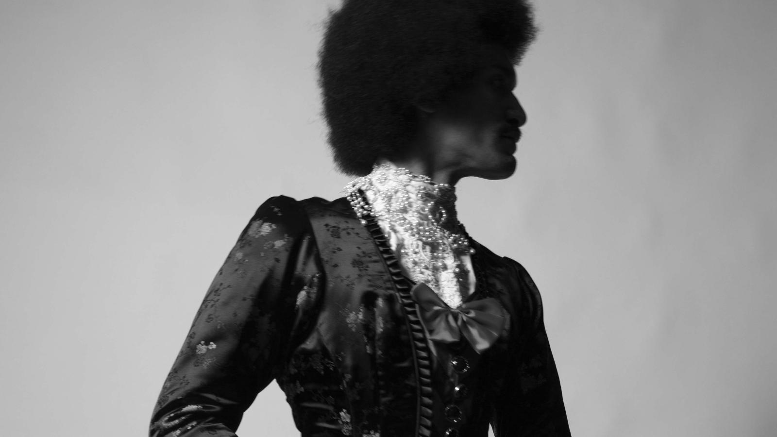 person not looking at the camera in Victorian dress